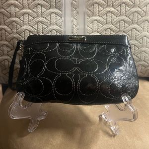 Patent Leather coach wristlet in excellent condition.